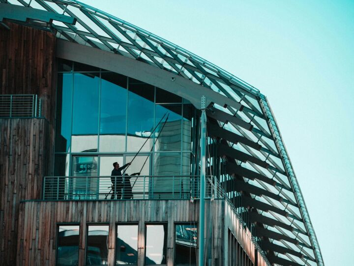 Pole cleaning on the glazed frontage of a low-rise venue