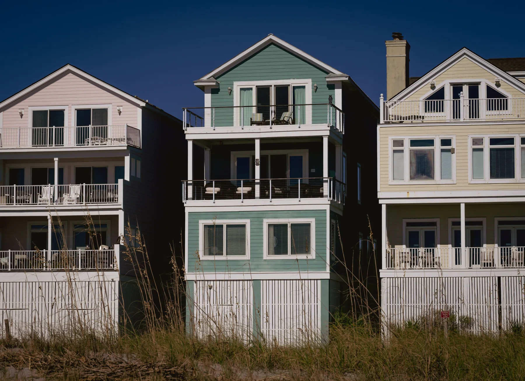 Low-rise weatherboard homes with painted siding