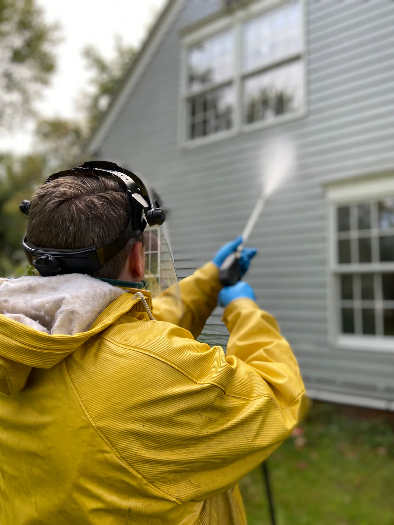 Stock image of exterior washing with protective equipment